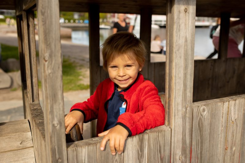 Beautiful town Kristiansand in Norway, family visiting Norway for summer vacation, kids enjoying amazing views